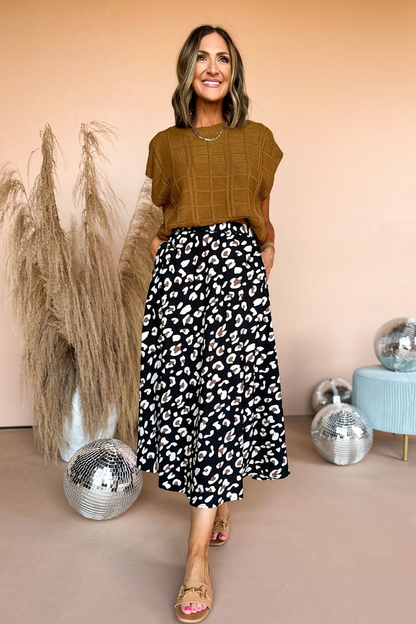 Load image into Gallery viewer, Black Animal Printed Pull On Midi Skirt, mom chic, carpool chic, elevated style, must have skirt, fall skirt, transitional skirt, chic style, midi skirt, must have midi, shop style your senses by mallory fitzsimmons
