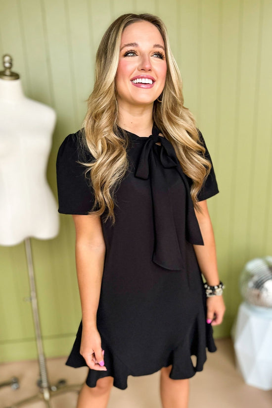 Load image into Gallery viewer, Black Tie Neck Short Sleeve Trumpet Skirted Dress, must have dress, little black dress, work to weekend, office dress, elevated style, must have style, mom style, shop style your senses by mallory fitzsimmons
