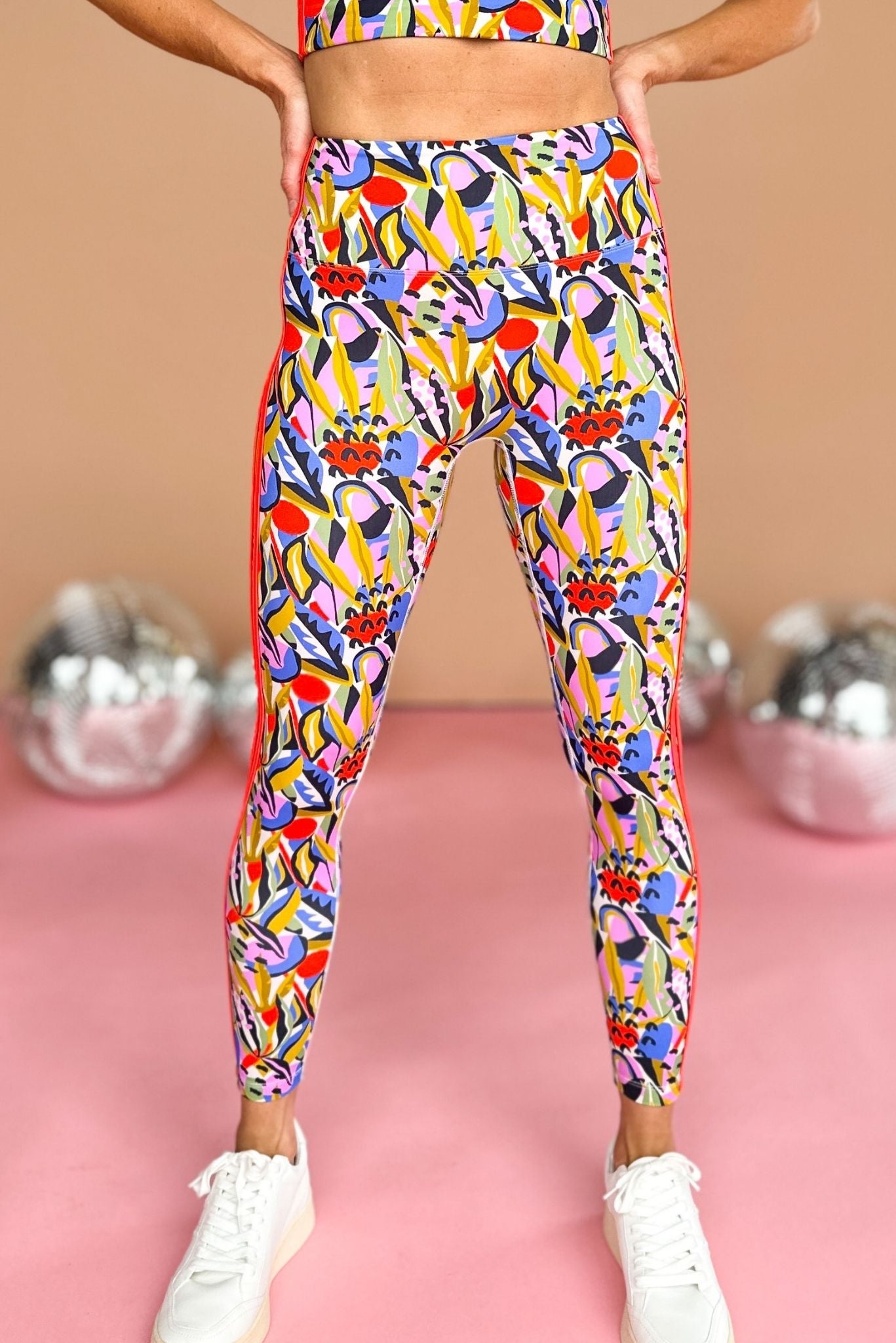 Load image into Gallery viewer, ssys vibrant abstract floral print compression leggings with racing stripes, ssys the label, athleisure, summer style, mom style, on the go, shop style your senses by mallory fitzsimmons
