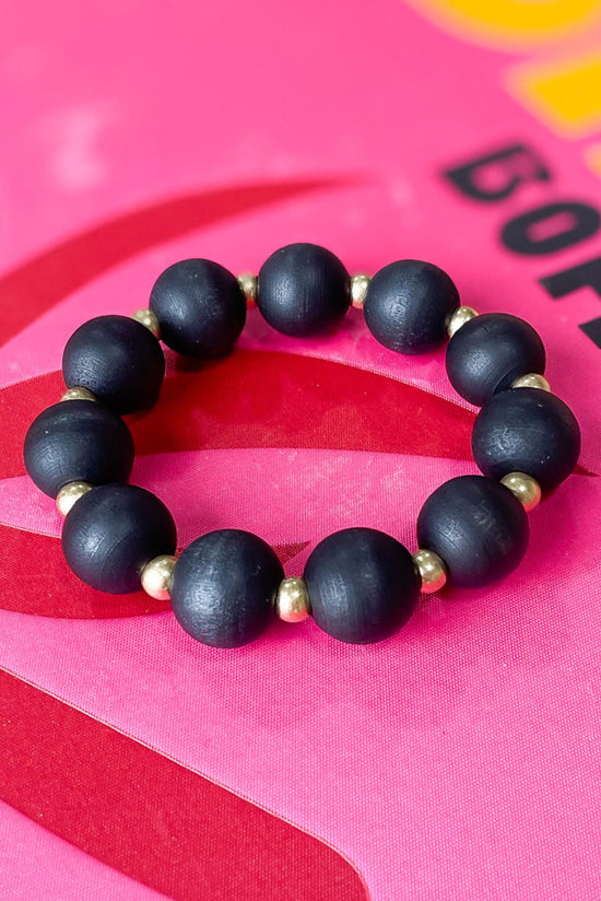 Load image into Gallery viewer, Black Wooden Ball Gold Bead Stretch Bracelet, black stretch bracelet, large ball stretch bracelet, everyday wear, stackable, shop style your senses by mallory fitzsimmons
