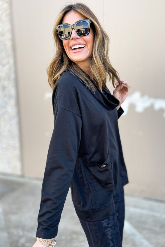 Load image into Gallery viewer, black cowl neck tunic top with pockets, cowl neck, black top, long sleeve, spring fashion, metallic leggings, sun glasses, pockets, loose fitting, mom style, shop style your senses by mallory fitzsimmons
