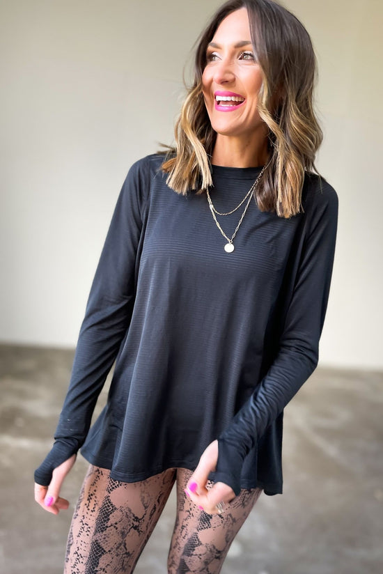 Load image into Gallery viewer, black long sleeve ribbed top with cut out back, affordable athleisure, fitness fashion, shop style your senses by mallory fitzsimmons
