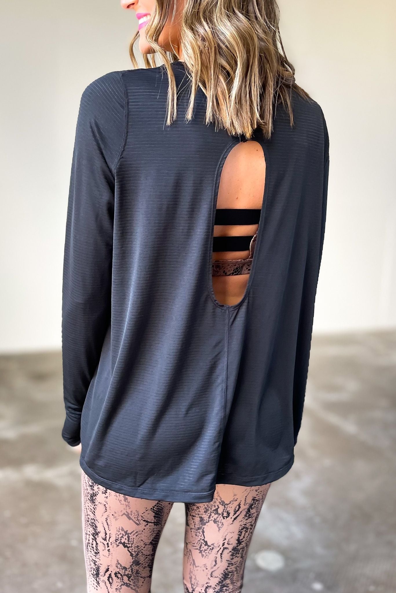 black long sleeve ribbed top with cut out back, affordable athleisure, fitness fashion, shop style your senses by mallory fitzsimmons