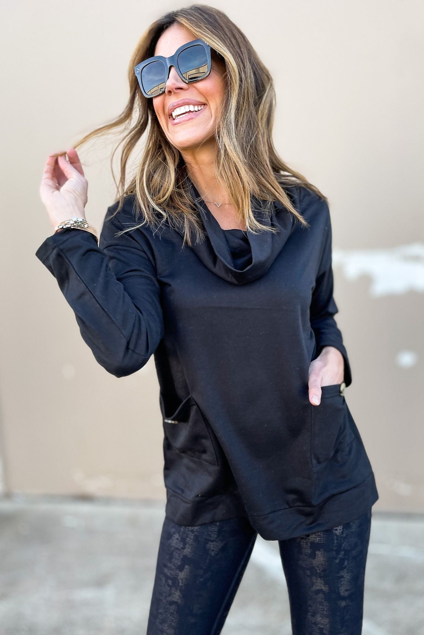 Load image into Gallery viewer, black cowl neck tunic top with pockets, cowl neck, black top, long sleeve, spring fashion, metallic leggings, sun glasses, pockets, loose fitting, mom style, shop style your senses by mallory fitzsimmons
