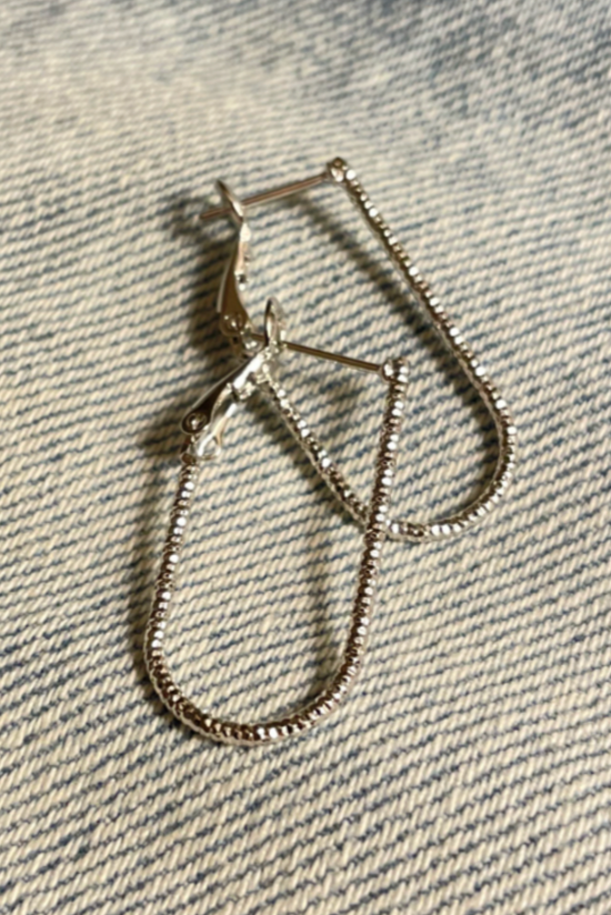 Silver Textured Metal Oval Hoop Earrings
